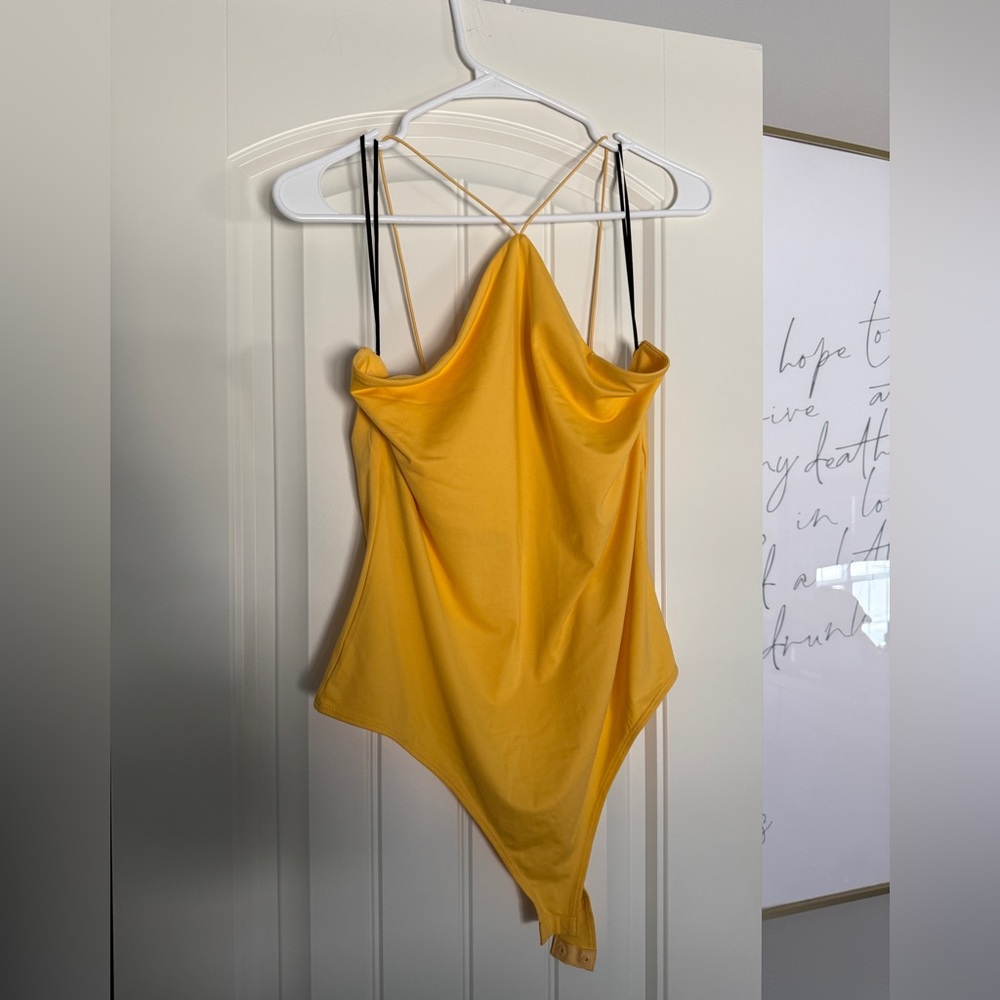 Yellow halter top bodysuit. Worn once. Great condition